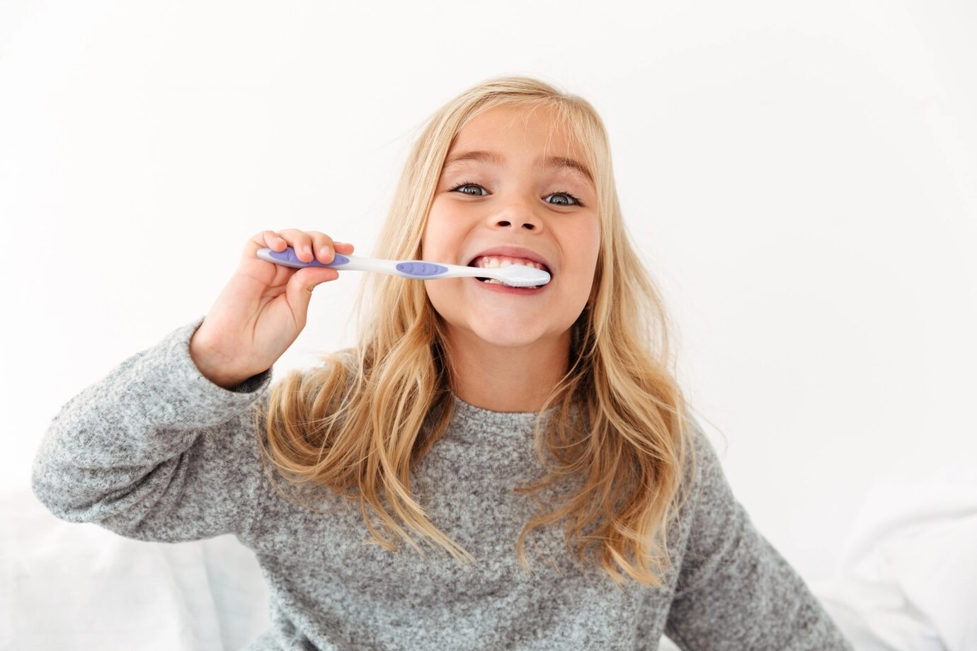 child taking care of their oral health